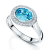 18ct White Gold Oval Cut Blue Zircon And Round Brilliant Diamond Rub Over Halo Dress Ring