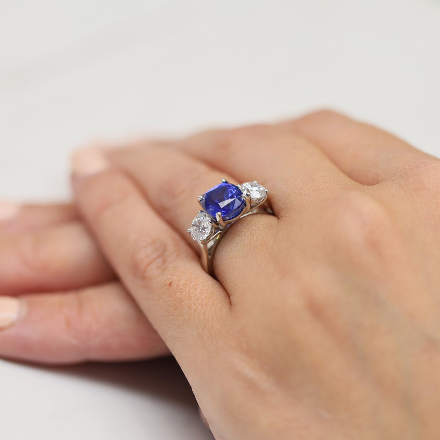 Platinum GIA Certificated Cushion Unheated Sri Lankan Sapphire And Round Brilliant Diamond Three Stone Ring