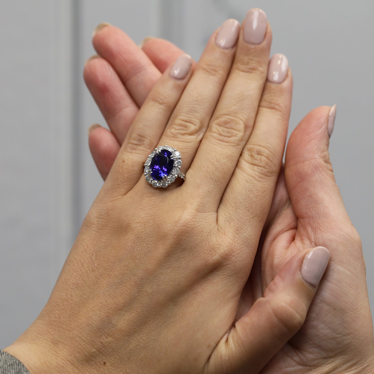 Platinum Oval Claw Set Tanzanite 5.89ct And Diamond Cluster Ring 1.70ct With Diamond Set Shoulders