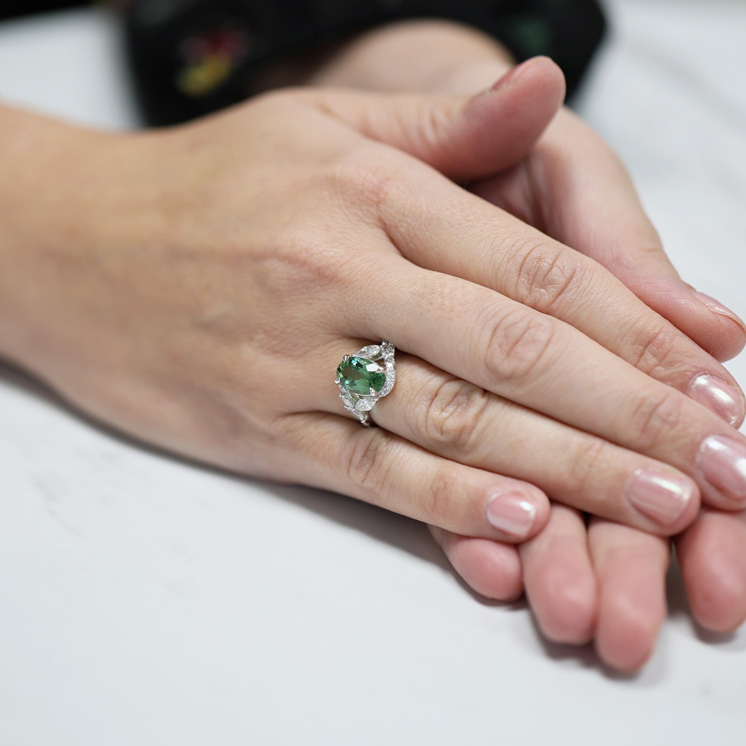 Platinum Oval Cut Green Tourmaline And Marquise And Round Brilliant Diamond Twist Ring