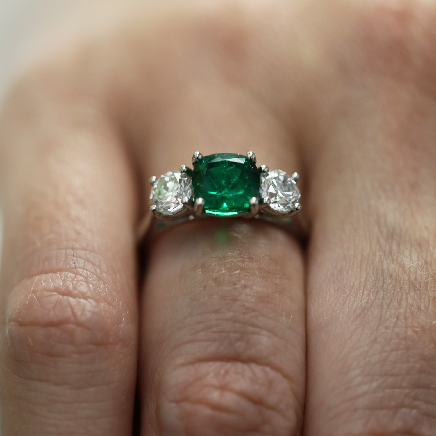 Platinum Cushion Cut Natural Emerald And Round Brilliant Cut Diamond 3 Stone Ring