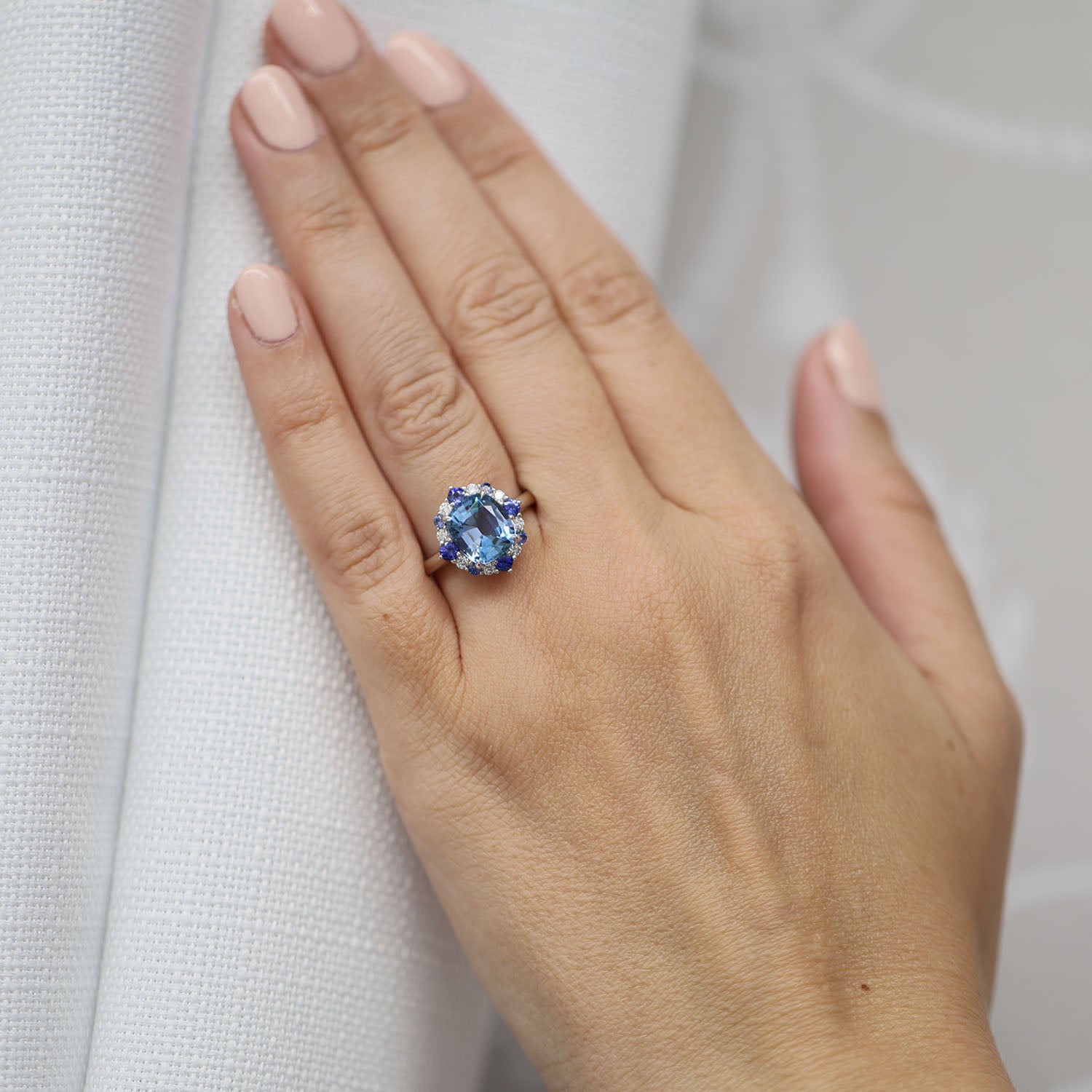 Berry's Platinum Cushion Cut Aquamarine Halo Dress Ring With Alternately Set Blue Sapphire and Diamonds. - Berry's Jewellers