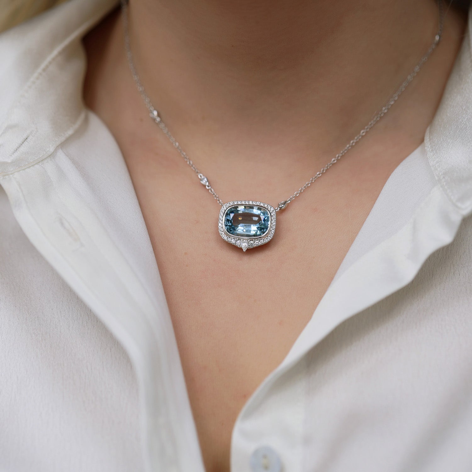 18ct White Gold Aquamarine And Diamond Halo Pendant