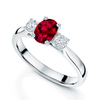 Platinum Oval Cut Ruby And Diamond Three Stone Ring