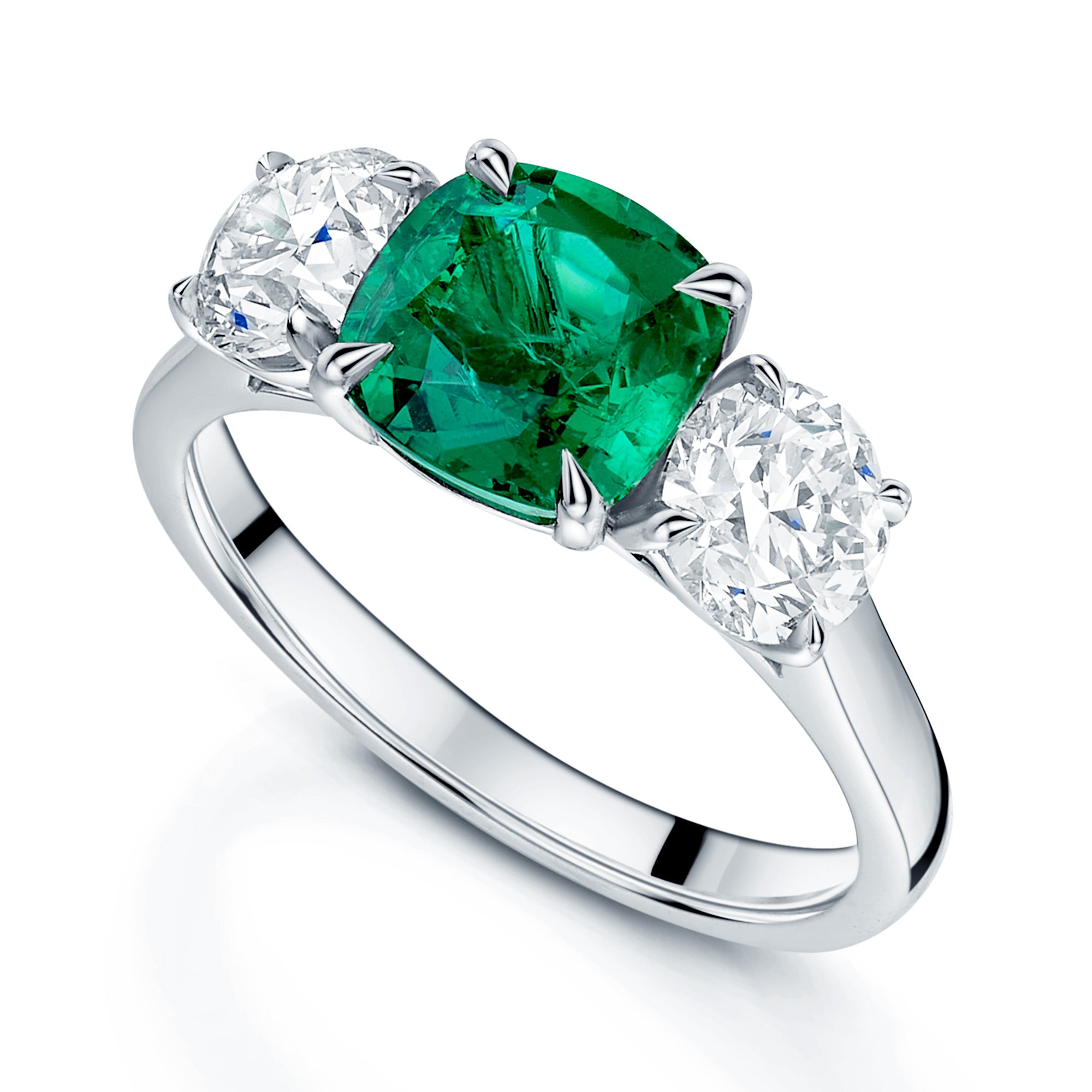 Platinum Emerald and Diamond Three Stone Ring