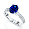 Platinum Oval Sapphire Dress Ring With Diamond Shoulders