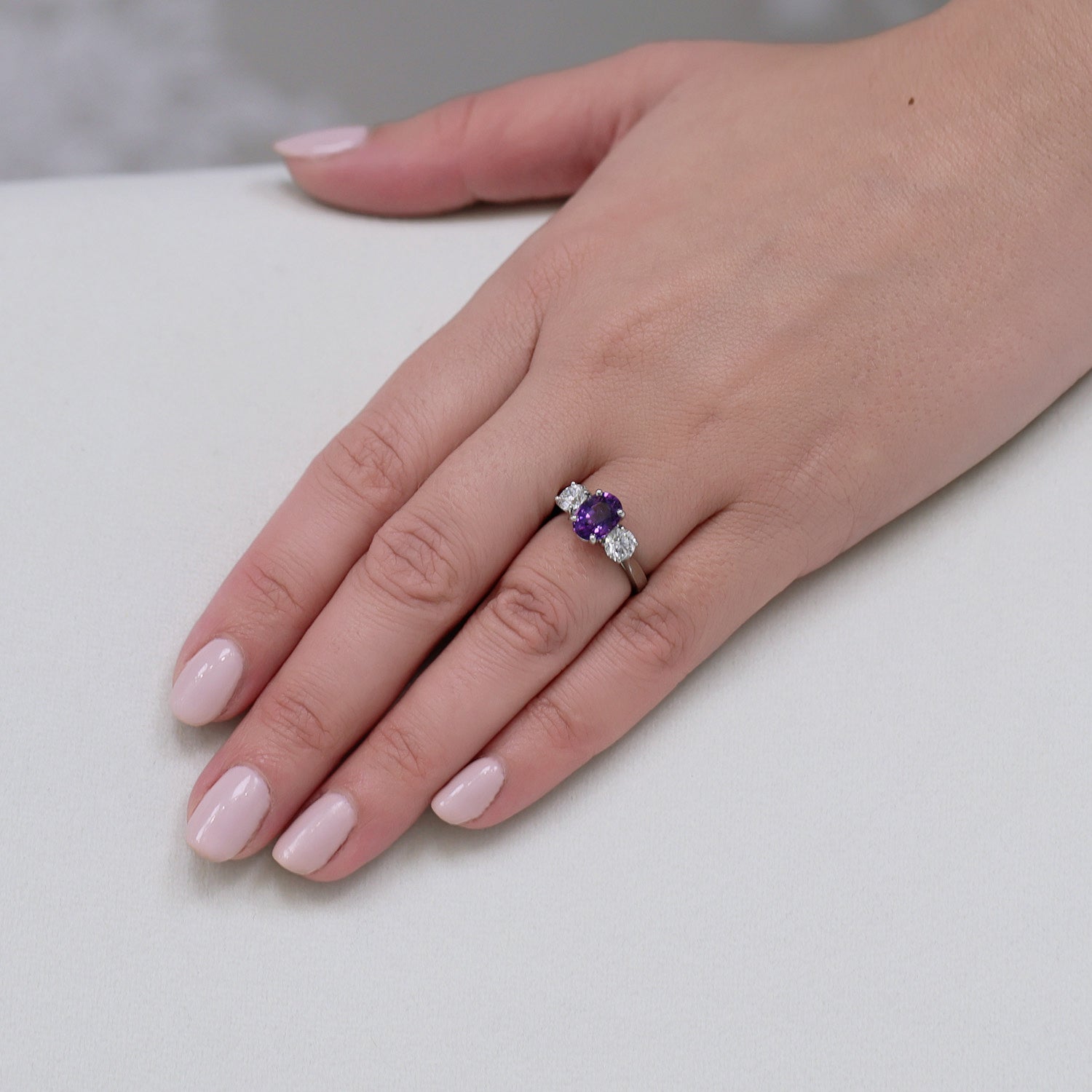 Berry's Platinum Oval Cut Purple Sapphire And Round Brilliant Cut Diamond Three Stone Ring - Berry's Jewellers