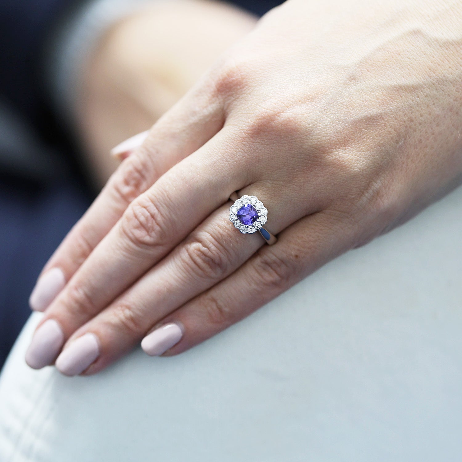 Platinum Cushion Cut Tanzanite Ring In A Diamond Halo Setting