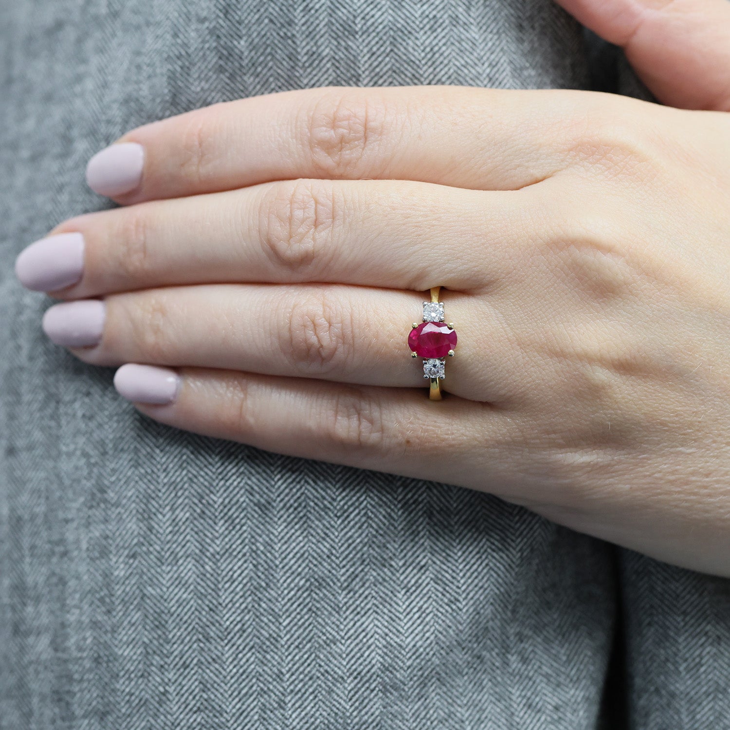 18ct Yellow Gold Oval Ruby And Round Brilliant Cut Diamond Three Stone Ring