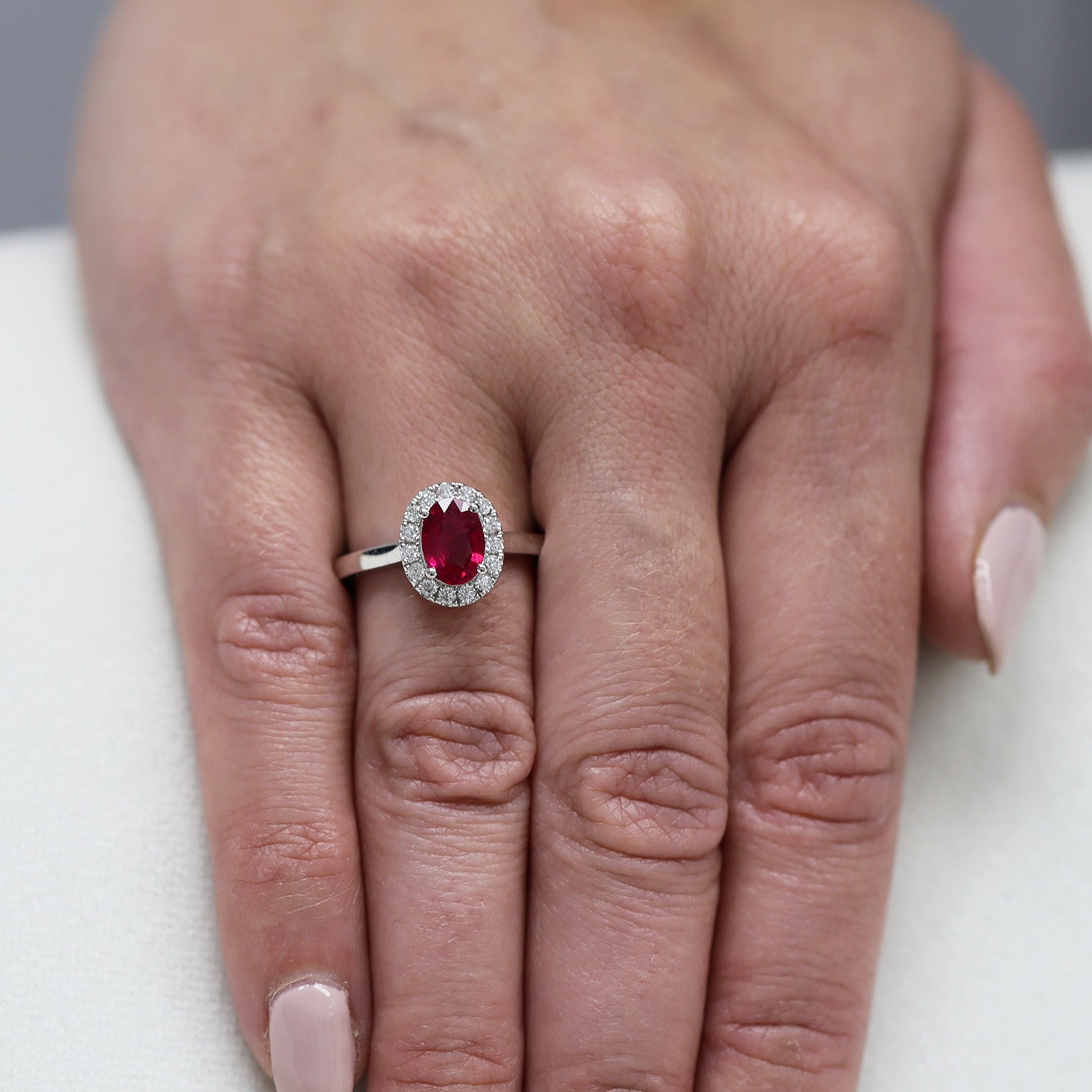 Platinum Oval Cut Ruby And Diamond Halo Ring