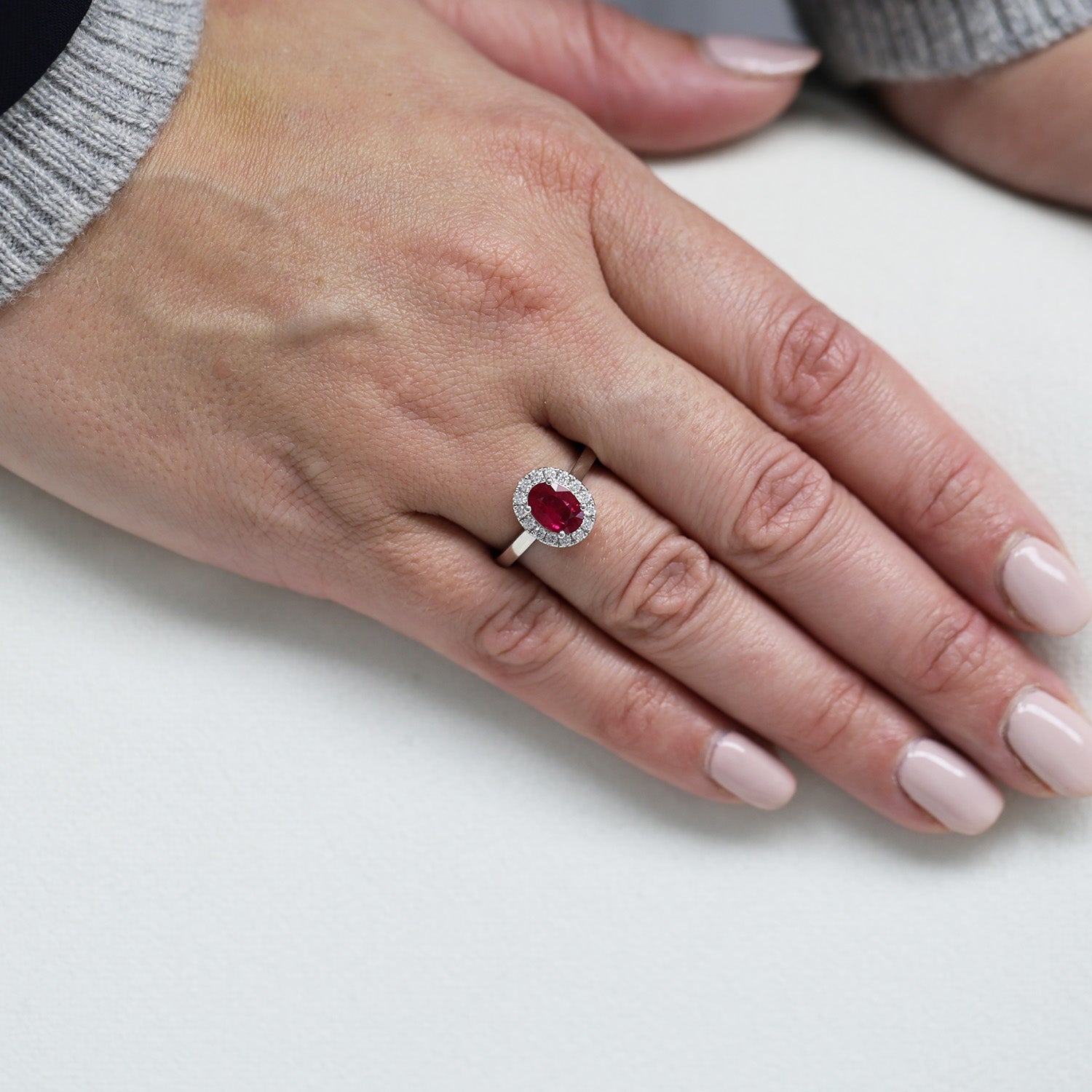 Platinum Oval Cut Ruby And Diamond Halo Ring