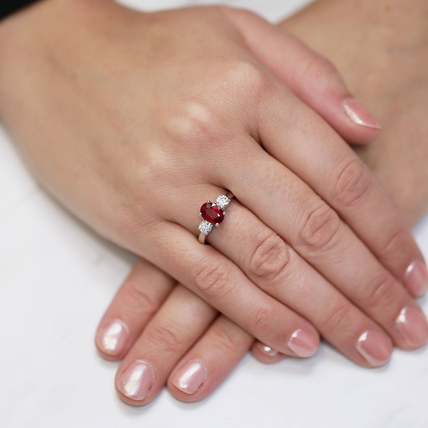 Platinum Oval Cut Ruby And Diamond Three Stone Ring