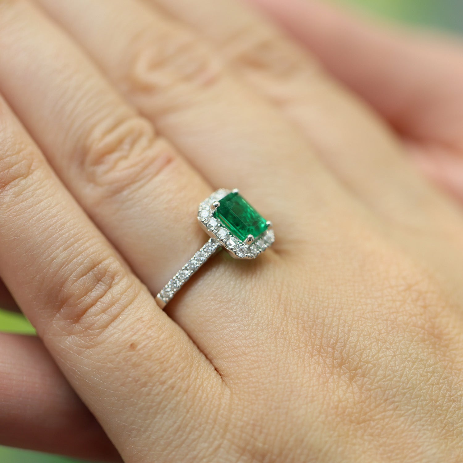 Platinum Emerald And Diamond Halo Ring With Diamond Shoulders