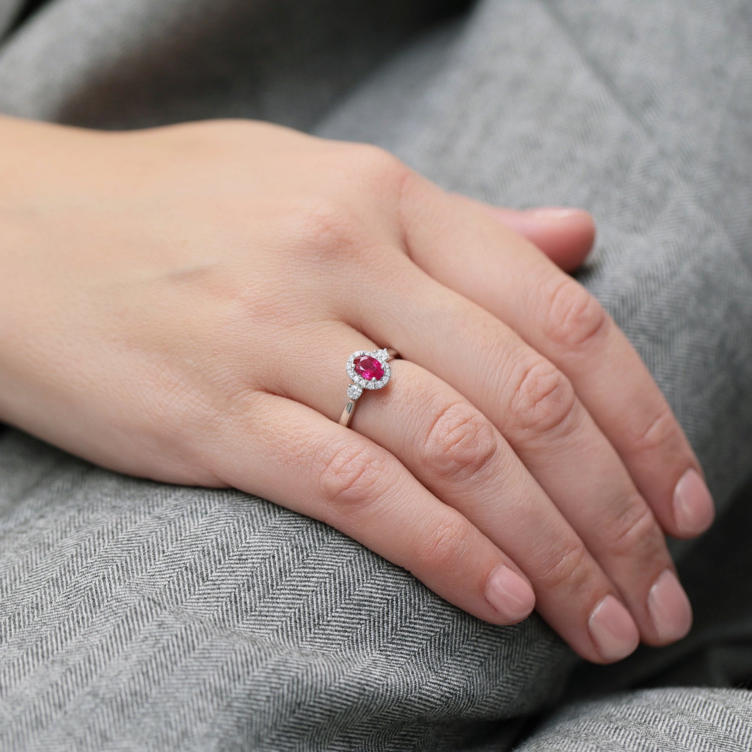 Platinum Oval Ruby And Diamond Cluster Ring With A Diamond On Each Shoulder,