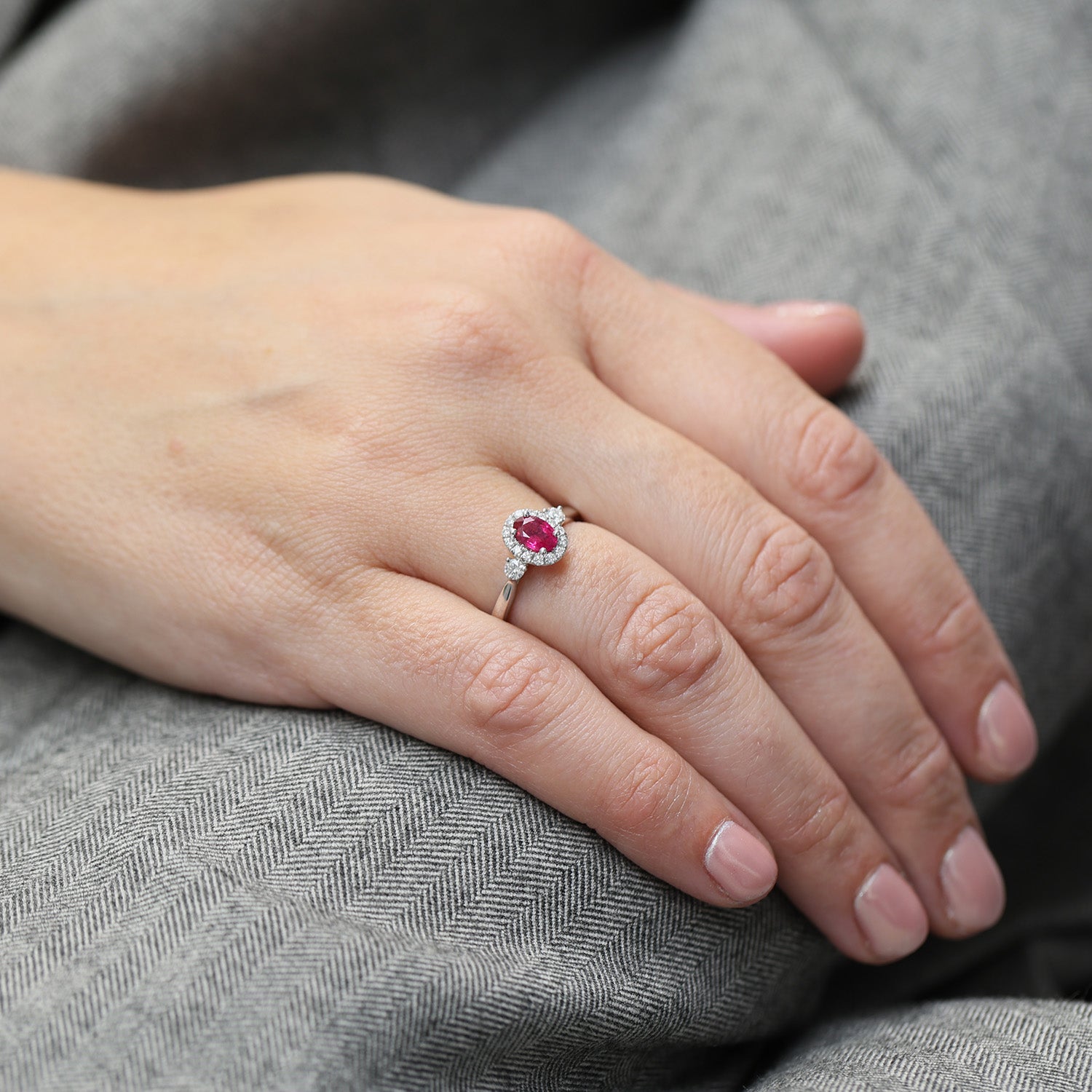 Platinum Oval Ruby And Diamond Cluster Ring With A Diamond On Each Shoulder,