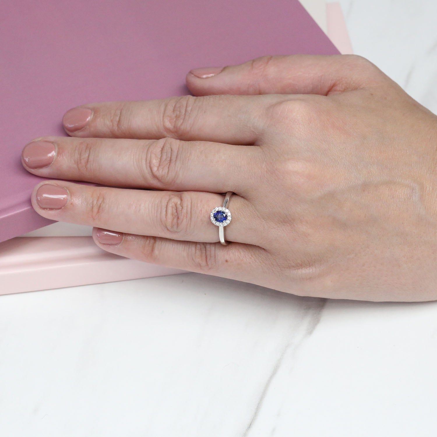 Platinum Oval Sapphire And Diamond Halo Ring