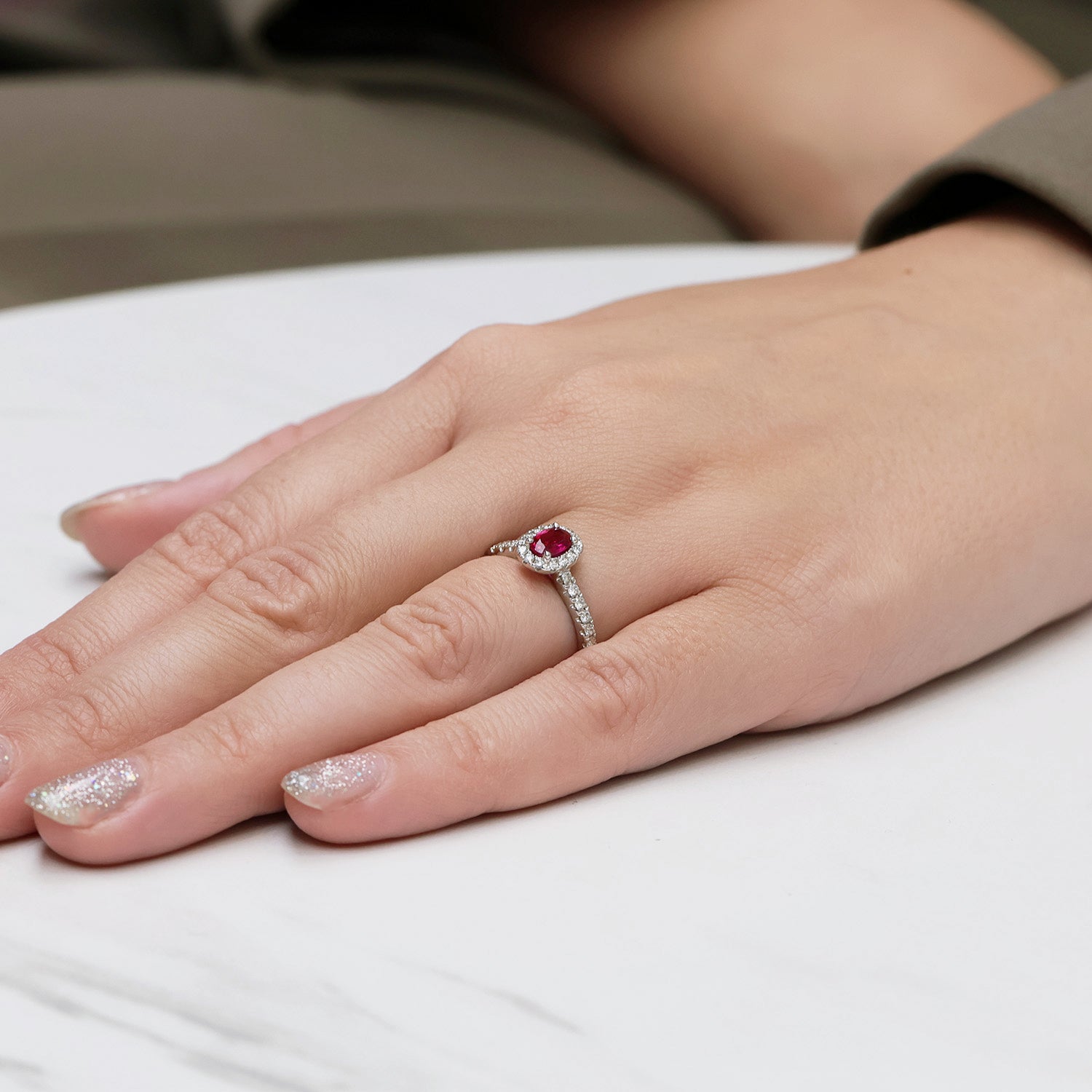 Berry's Platinum Oval Cut Ruby In a Diamond Halo Setting With Diamond Set Shoulders - Berry's Jewellers