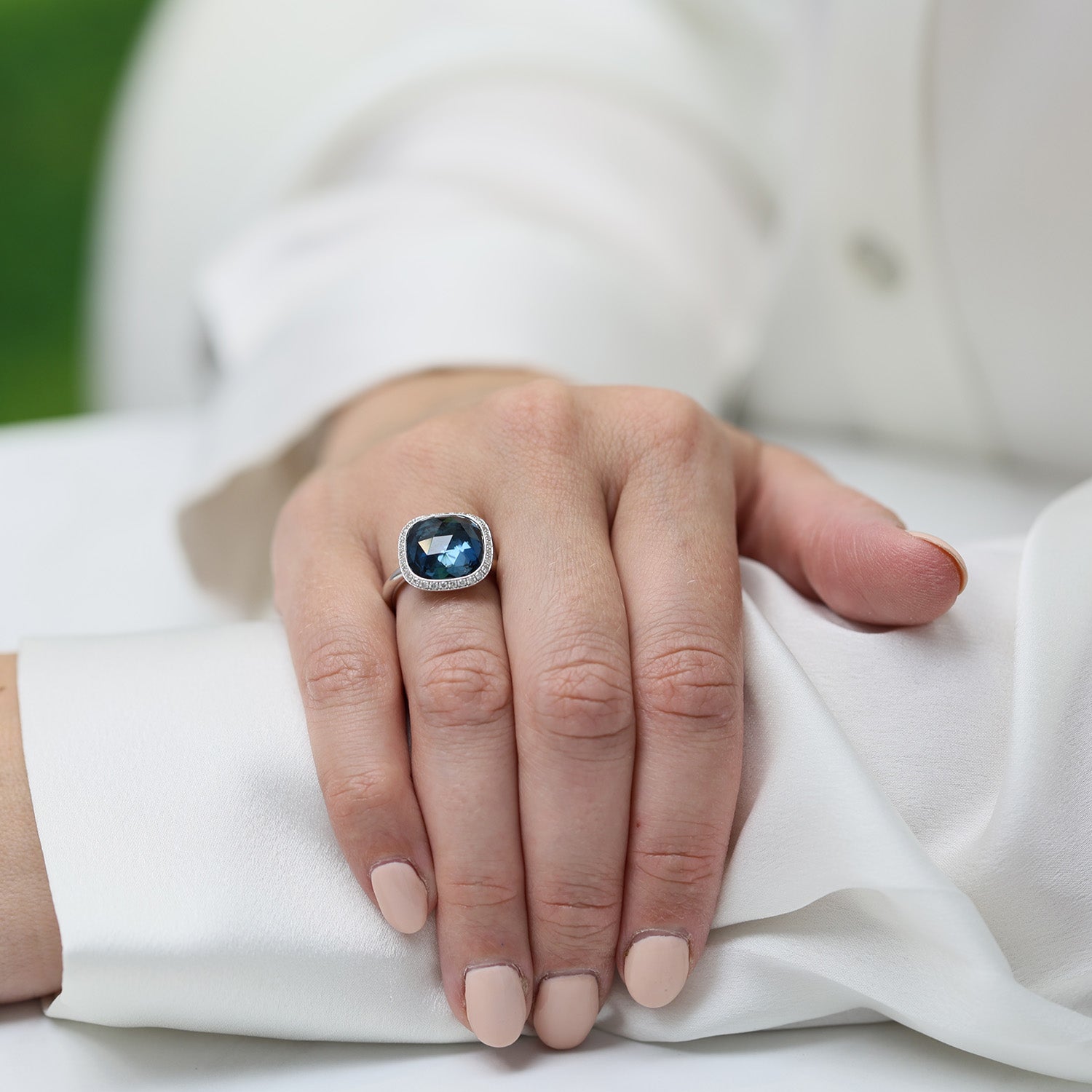 18ct White Gold London Blue Topaz Fancy Ring With A Round Brilliant Cut Halo Surround