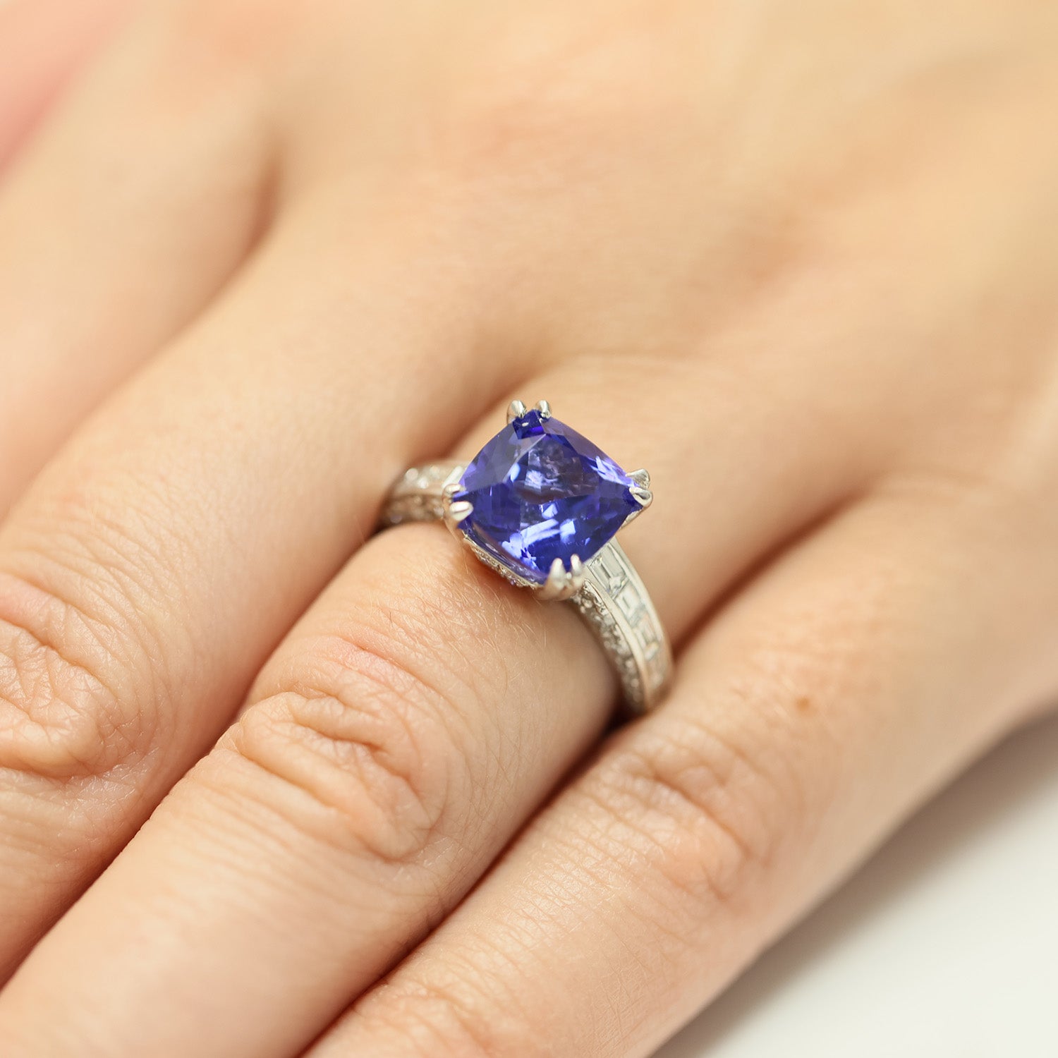 Platinum Tanzanite Ring With Baguette Diamond Shoulders & Diamond Pave Under Bezel