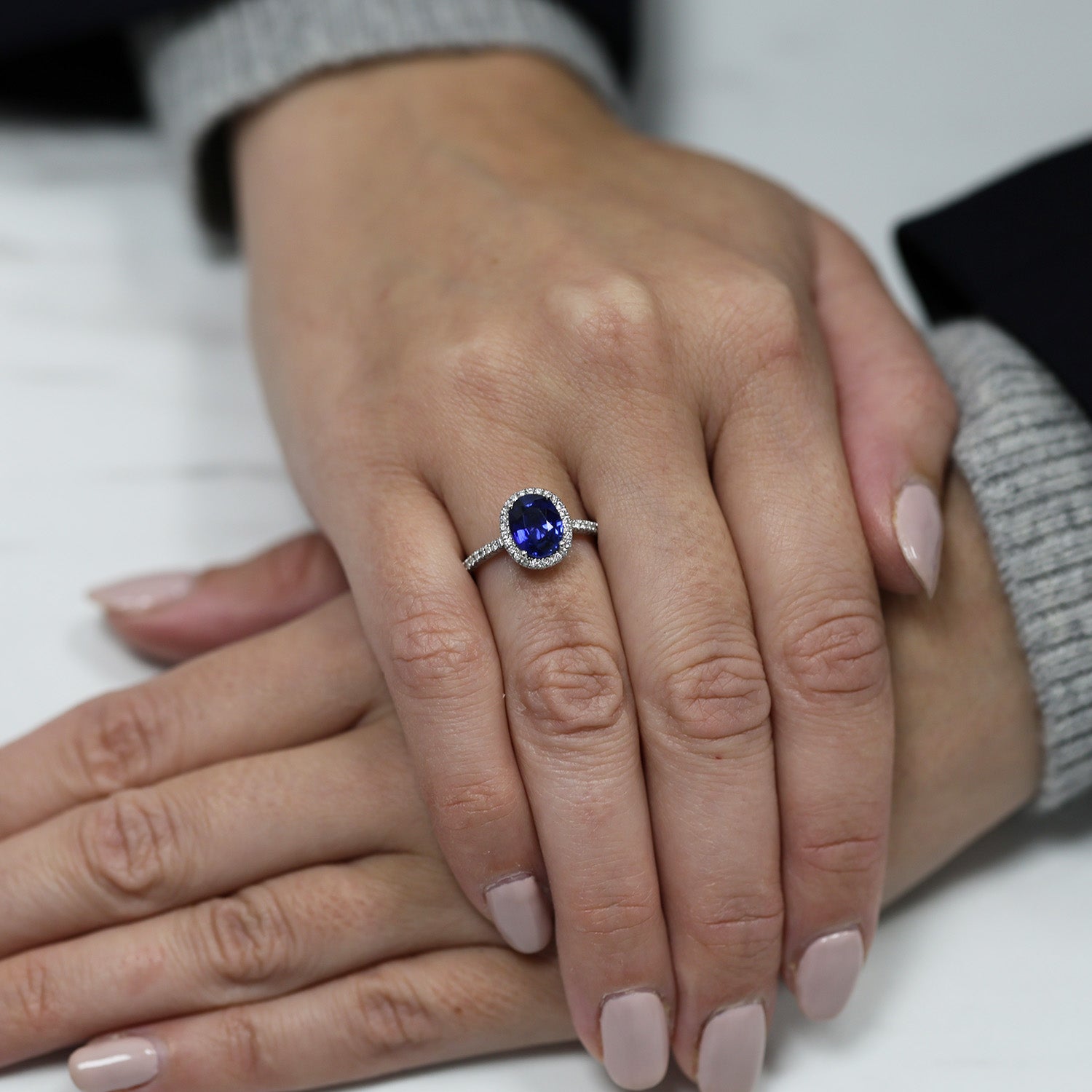 Platinum Oval Sapphire And Diamond Cluster Ring With Diamond Set Shoulders