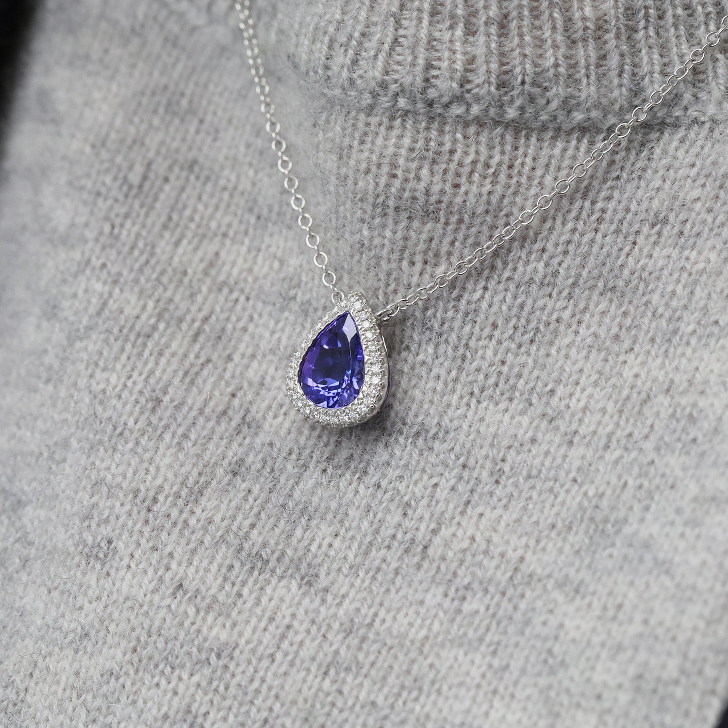 18ct White Gold Pear Cut Tanzanite And Diamond Halo Pendant