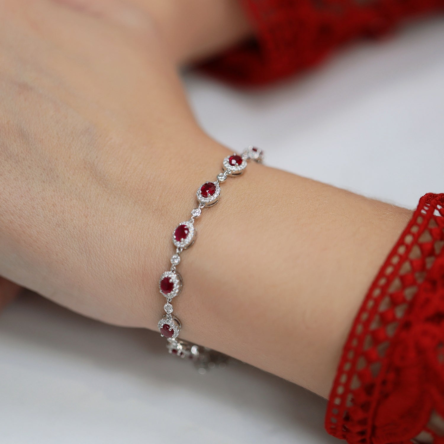 18ct White Gold Oval Ruby And Diamond Halo Bracelet