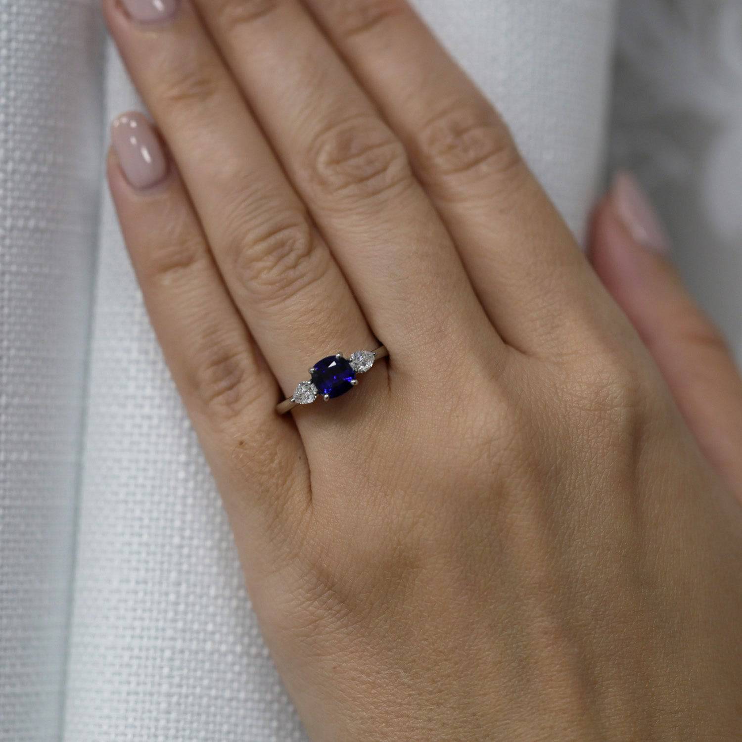 Berry's Platinum Cushion Cut Blue Sapphire & Pear Cut Diamond Three Stone Ring - Berry's Jewellers