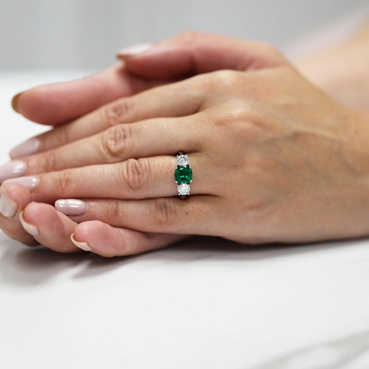 Berry's Platinum Cushion Cut Natural Emerald And Round Brilliant Cut Diamond 3 Stone Ring - Berry's Jewellers