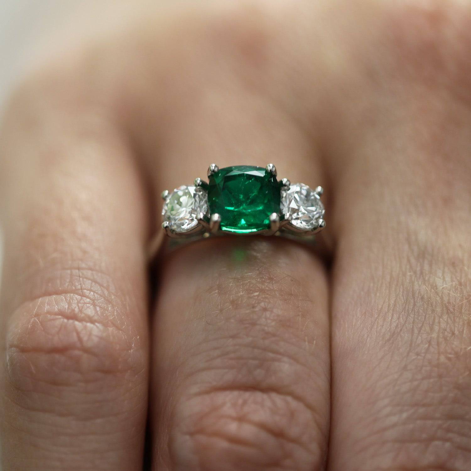 Berry's Platinum Cushion Cut Natural Emerald And Round Brilliant Cut Diamond 3 Stone Ring - Berry's Jewellers