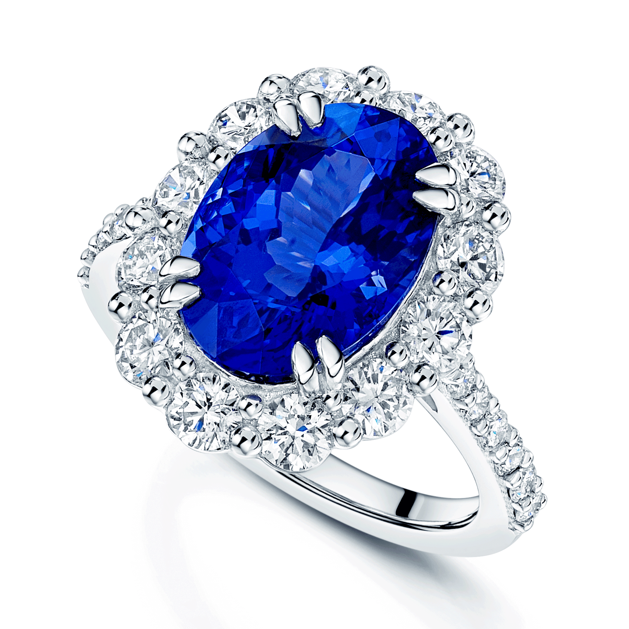 Berry's Platinum Oval Claw Set Tanzanite 5.89ct And Diamond Cluster Ring 1.70ct With Diamond Set Shoulders - Berry's Jewellers