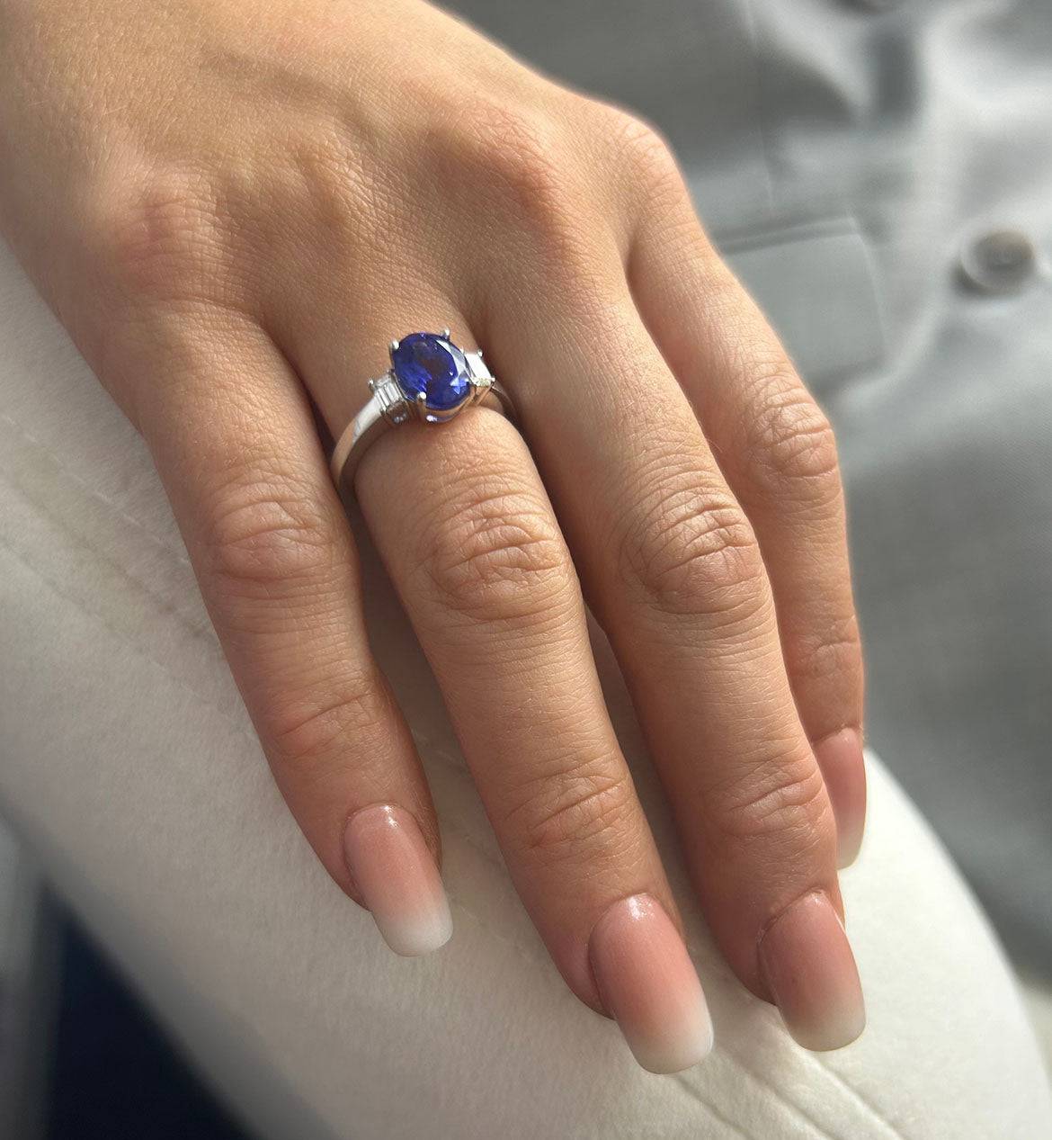 Platinum Oval Cut Tanzanite Ring With Baguette Diamond Shoulders