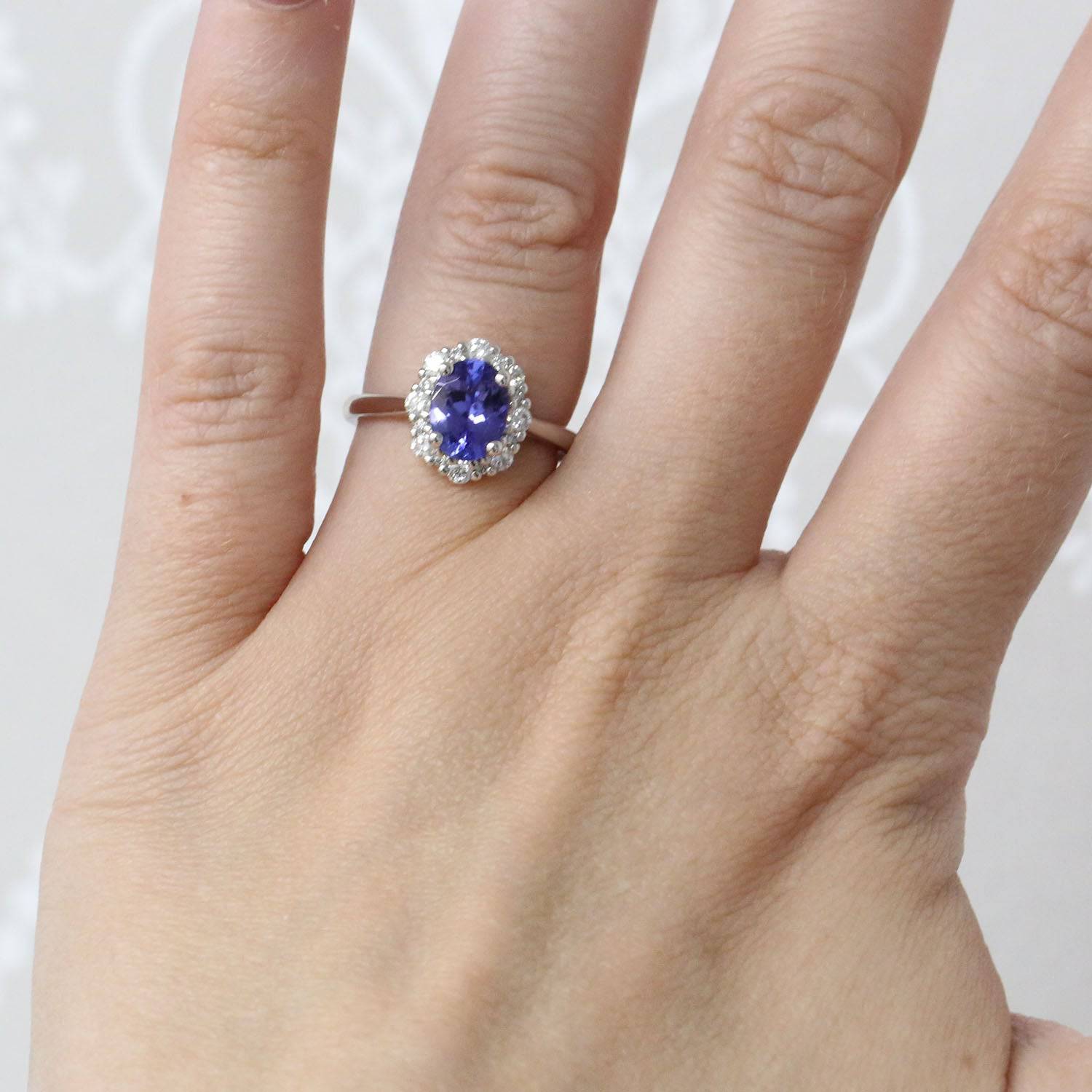 Platinum Oval Tanzanite And Round Brilliant Diamond Cluster Ring