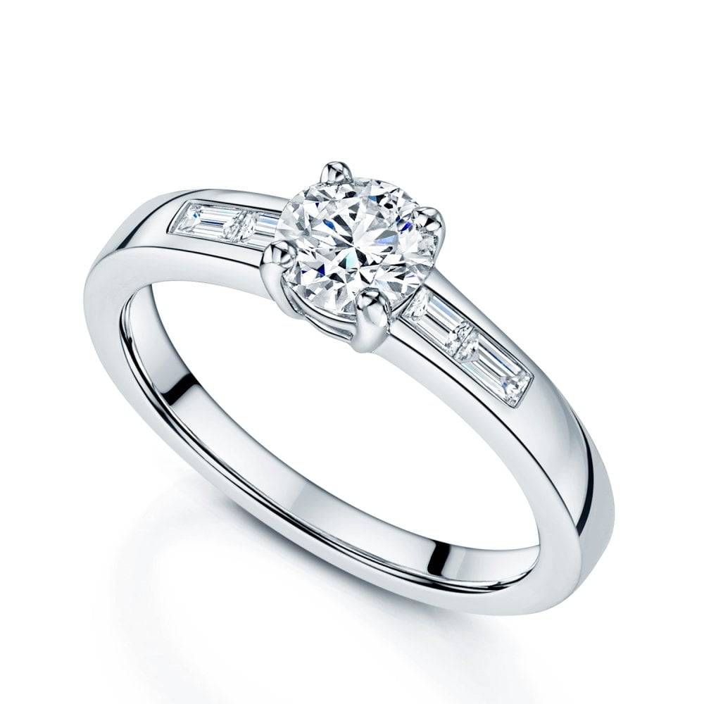 Platinum Round Brilliant Cut 0.70 Carat Diamond Ring With Baguette Cut Diamond Shoulders