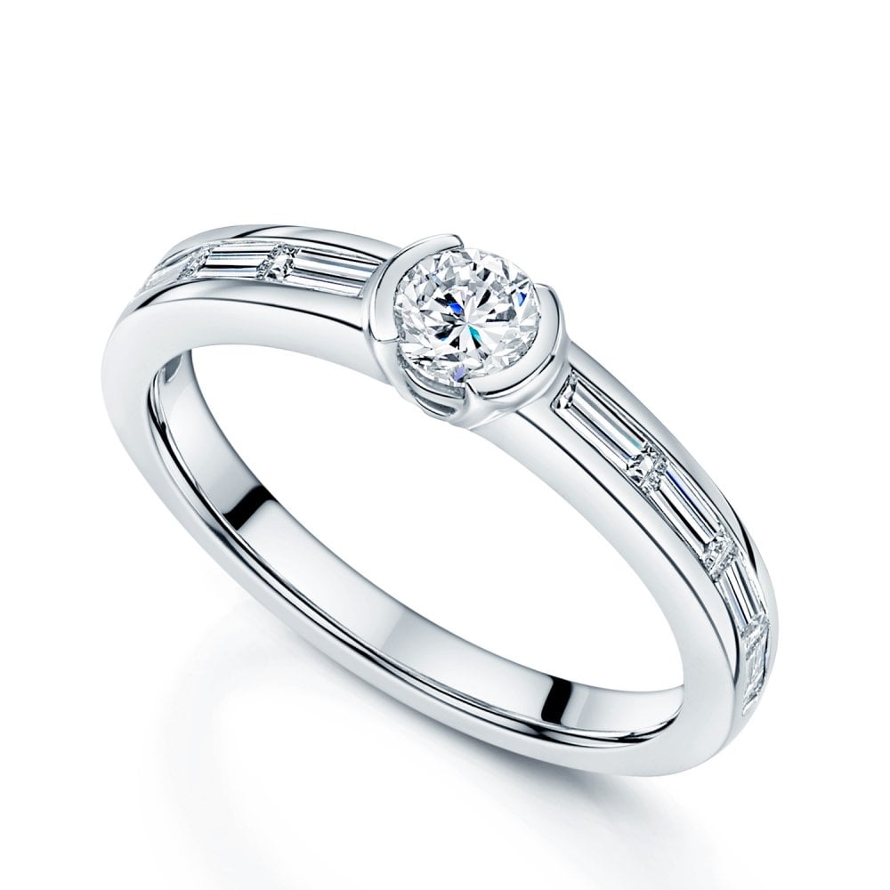 Platinum Round Brilliant Cut Diamond Tension Set Ring With Baguette Cut Diamond Shoulders