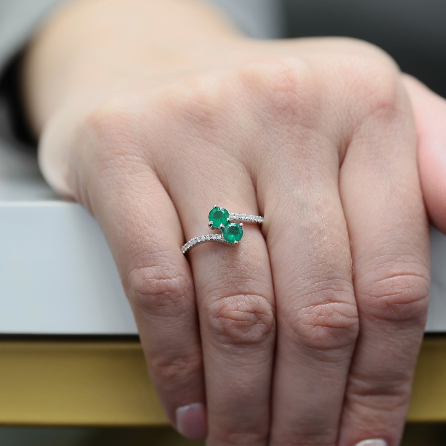 Berry's Platinum Round Brilliant Cut Emerald Two Stone Twist Ring With Diamond Set Shoulders - Berry's Jewellers