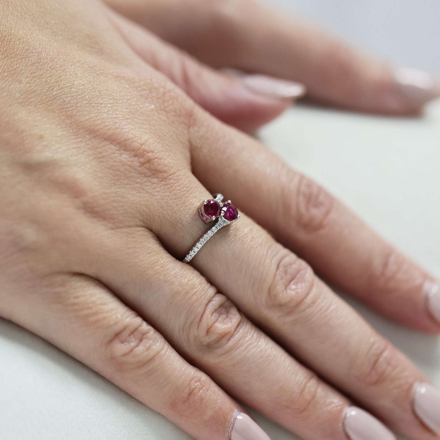 Platinum Round Brilliant Cut Ruby Two Stone Twist Ring With Diamond Set Shoulders