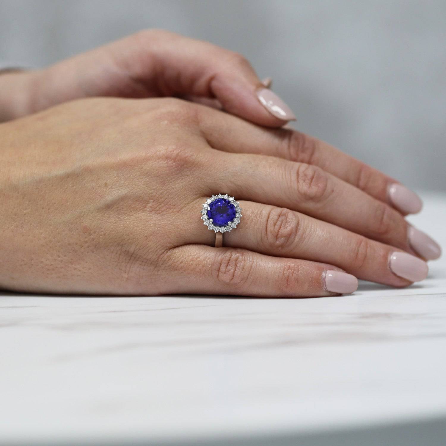 Berry's Platinum Round Tanzanite And Diamond Claw Set Cluster Ring - Berry's Jewellers