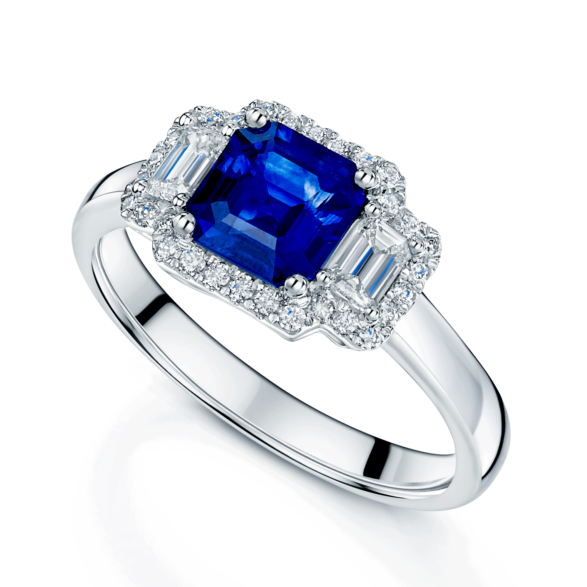 Platinum Sapphire And Diamond Three Stone Halo Dress Ring