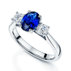 Berry's Platinum Oval Cut Sapphire Three Stone Ring With Two Round Brilliant Cut Diamonds - Berry's Jewellers